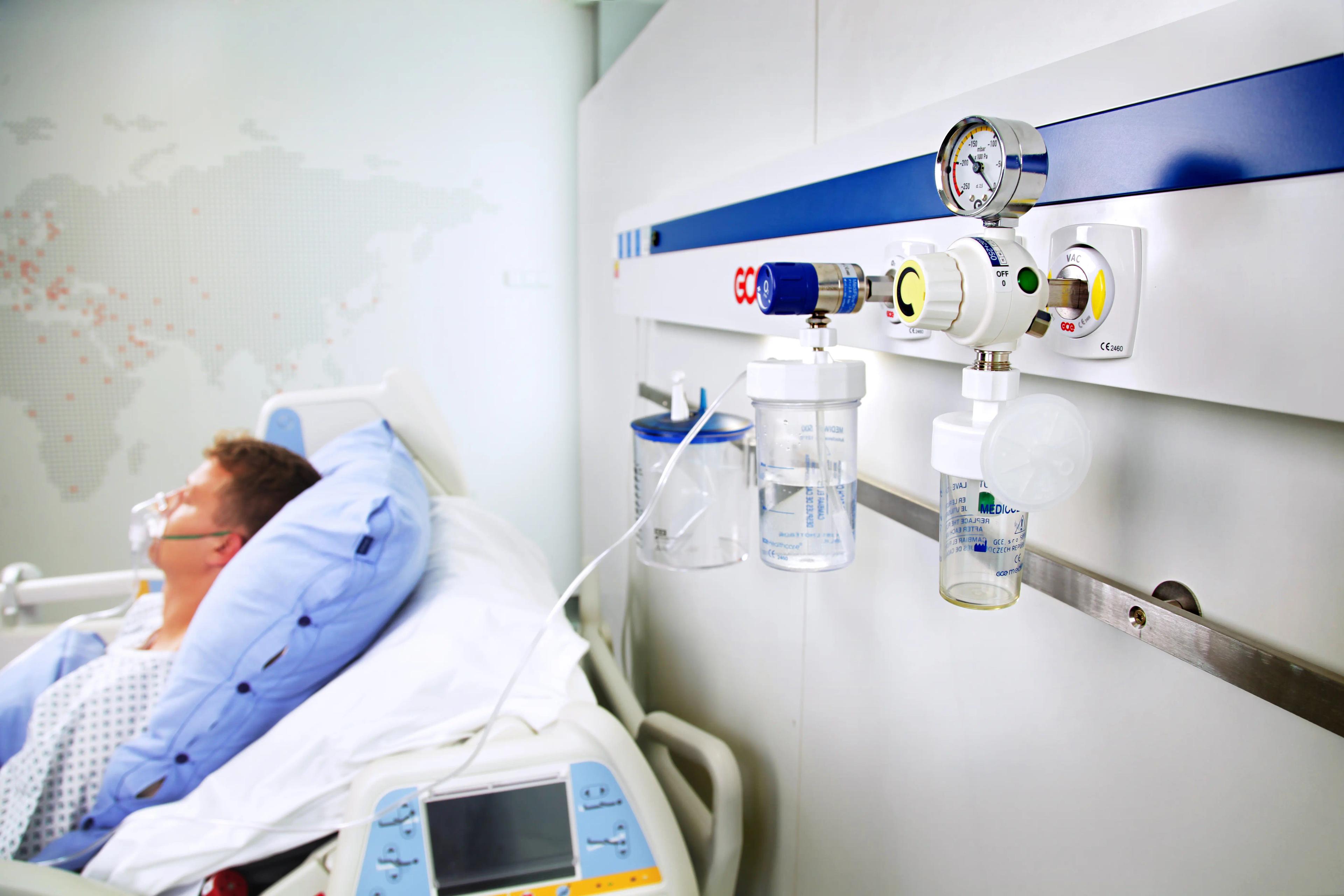 MediCollect in bed head unit next to patient in bed